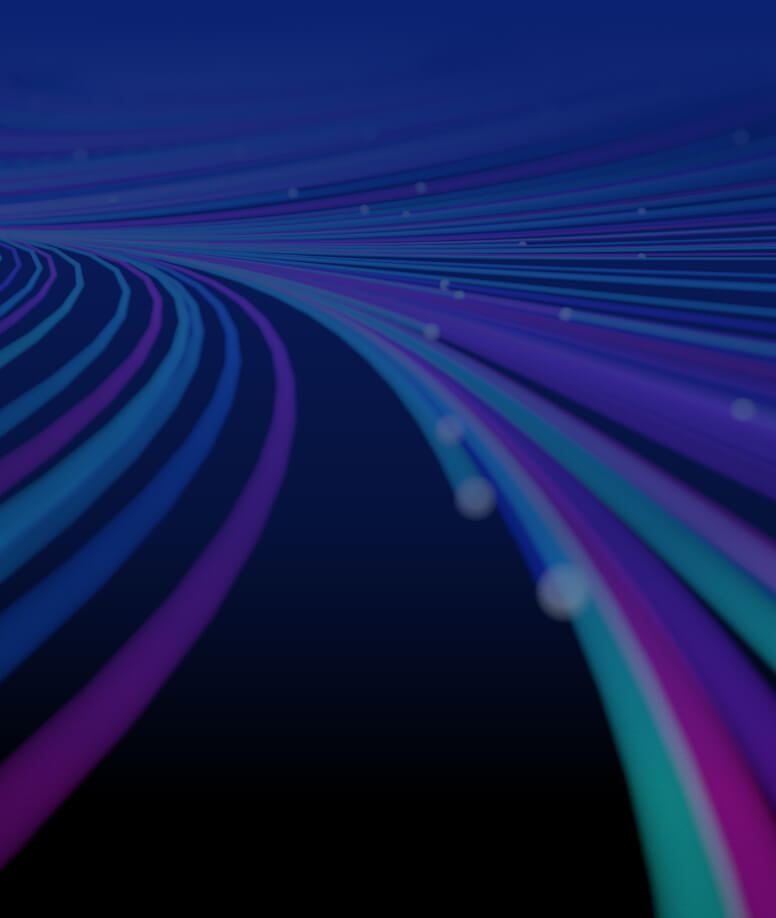 Zoomed out, unfocused image of abstract glowing spiral lines of bright purple, green and blue.